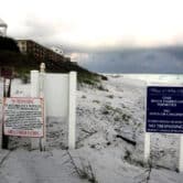 Private property and no trespassing signs on the beaches of Walton County Florida