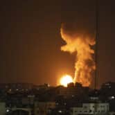 Fire and smoke rise after an airstrike in Gaza Strip.