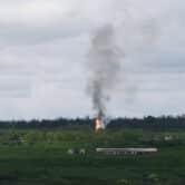 Fire and smoke rise after artillery shelling in rural Ukraine.