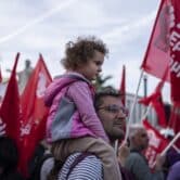 A father and his daughter attend a pre-election rally in Athens.