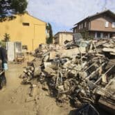 Volunteers clean up flooding damage in Faenza, Italy.