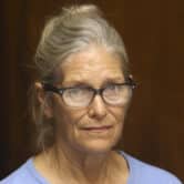 Leslie Van Houten wears glasses while sitting during a parole hearing.
