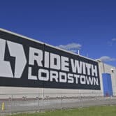 A mural with the words "Ride with Lordstown" and the company's logo on the side of a plant in Ohio.