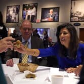 Nikki Haley passed an autographed wooden egg to a guest at an event at Saint Anselm College.