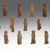 Ancient clay figurines of boys and girls.