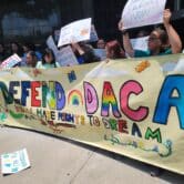 Supporters of the Deferred Action for Childhood Arrivals program hold up a banner outside the Houston federal courthouse on June 1, 2023.