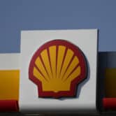 A Shell logo on a gas station.