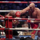 Tyson Fury punches Derek Chisora during a boxing match.