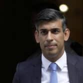 Rishi Sunak leaves 10 Downing Street while wearing a suit.