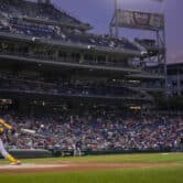 The Atlanta Braves' Ronald Acuña Jr. hits a ball during an MLB game at Nationals Park.