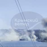 Smoke rises after a missile attack on a harbor hosting Russian military ships in Crimea.