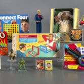 Several board games, two baseball cards and various generations of games and figurines.