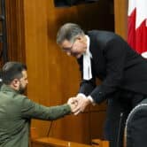 Volodymyr Zelenskyy shakes hands with Anthony Rota in Canada's House of Commons.