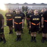 More than a dozen students stand during an exercise at Fort Jackson.