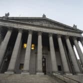 Photo shows the exterior of the New York County Supreme Court building