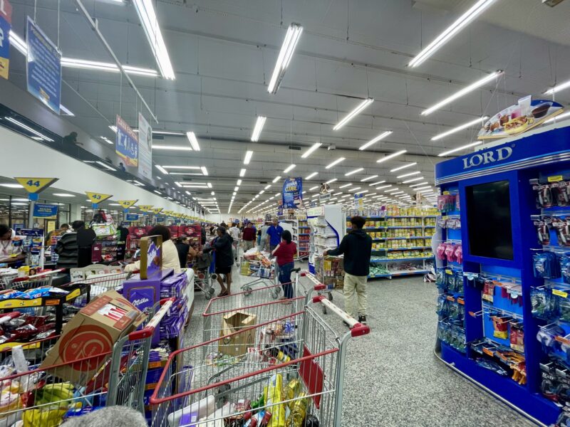 Customers shop at a Guanabara supermarket in Niteroi, Rio de Janeiro state, one of the main businesses accepting the city's Arariboia social currency.