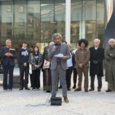 Man speaks Infront of a crowd