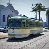 A cable car rides along the wharf in San Frncisco