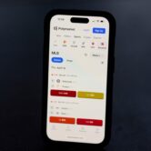 Smartphone displays Polymarket sports betting app