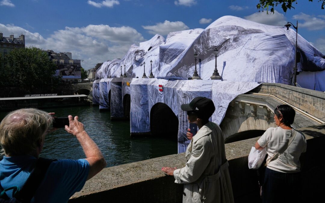 Artist JR, the ‘French Banksy’ creates a ‘cave’ installation over Paris’ oldest bridge