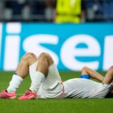 Iran forward Mehdi Taremi lies on his back with his hands over his face after the World Cup Group G match against Egypt in Seattle.