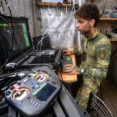 A Ukrainian serviceman operates an interceptor drone from a command center in the Kharkiv region.