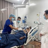 Medical staff treat an Indian tourist rescued from a capsized speedboat at a hospital in Phu Quoc, Vietnam.