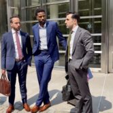 Former NBA player Malik Beasley stands outside Brooklyn federal court with attorneys David Gelfand and Jason Goldman.